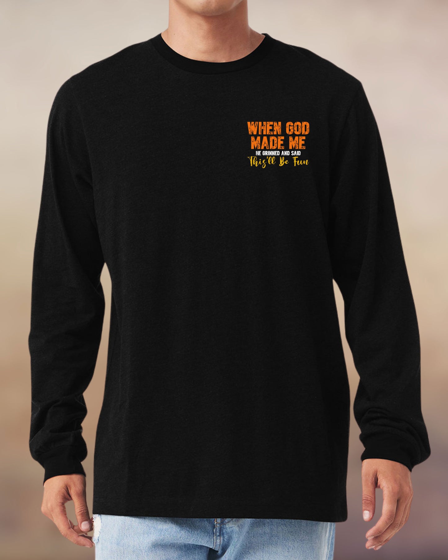 Christian long sleeve black tee with a fun message: “When God made me, He grinned and said this’ll be fun.