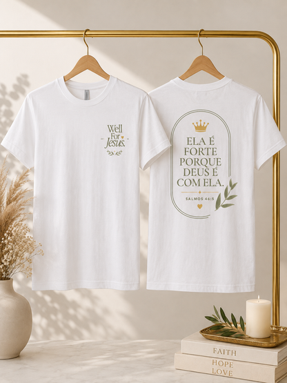 Two white short-sleeve T-shirts hanging on a gold clothing rack, shown front and back. The front shirt has a small gold chest print reading 'Well For Jesus,' and the back shirt has a large oval gold print with Portuguese text, a small crown, and olive branch details.