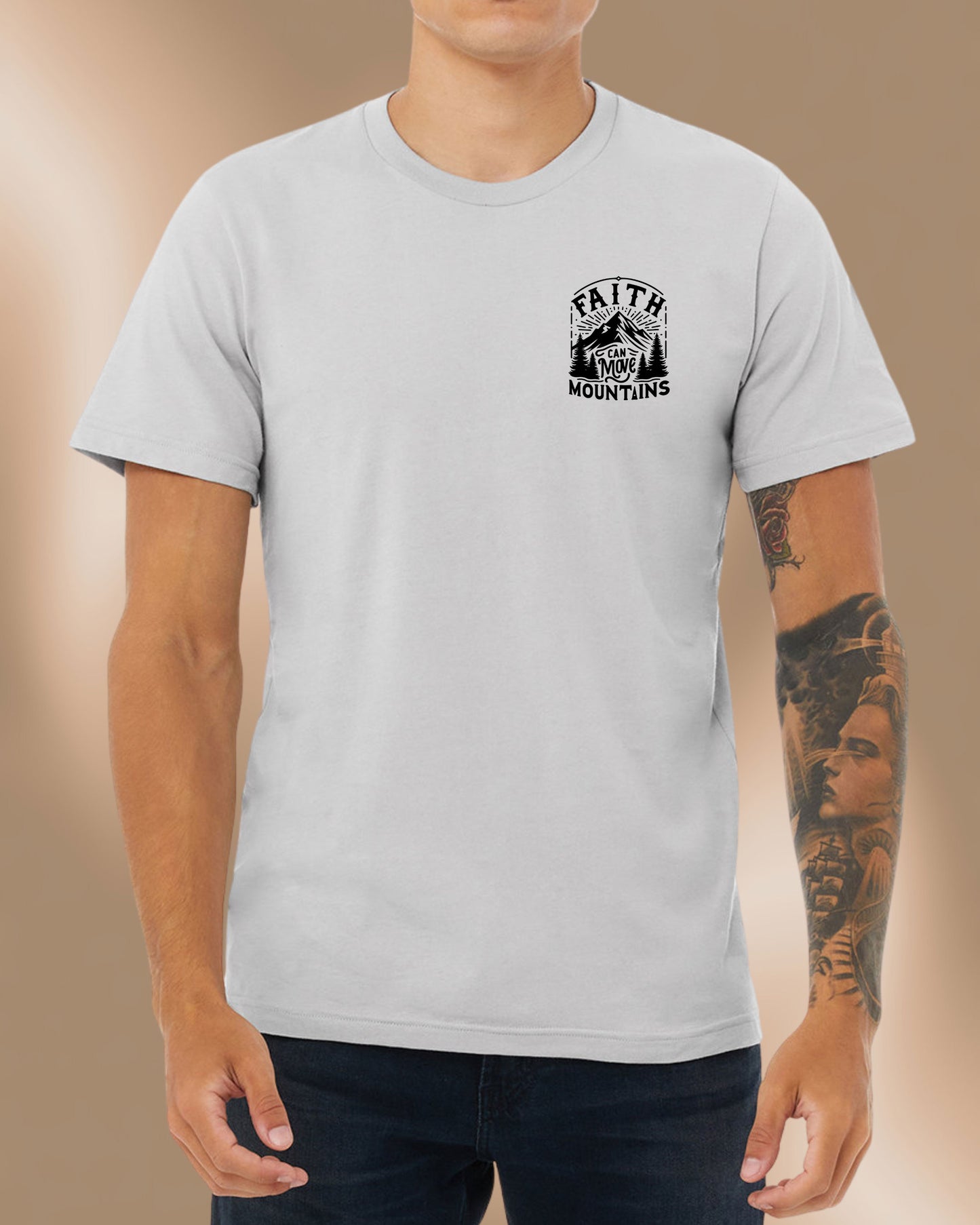 Athletic grey t-shirt featuring a bold mountain design and the phrase “Faith Can Move Mountains.” Front of the shirt