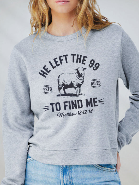 Front view of He Left the 99 Christian sweatshirt in athletic heather with sheep design and Matthew 18:12-14 scripture.