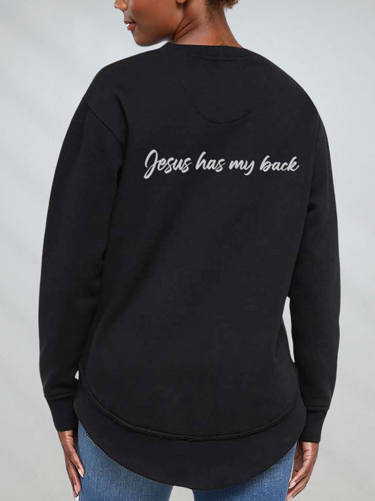 Black sweatshirt with 'Jesus has my back' text on the back, worn by a person against a plain background.