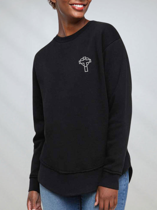 Front of the oversized black crewneck sweatshirt with cross outline on chest