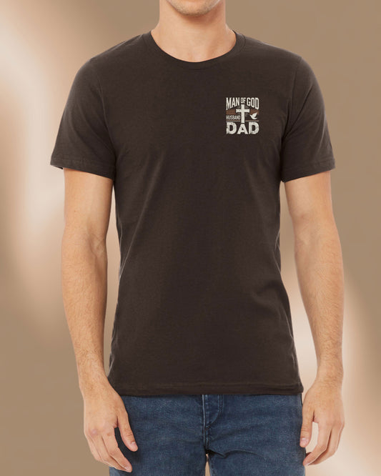 Brown Christian men’s t-shirt with bold “Man of God, Husband, Dad” design printed on the front with a cross and dove.