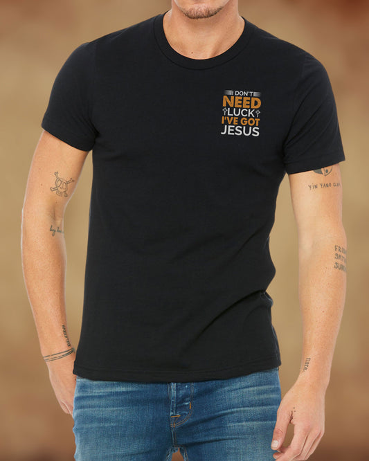 Christian black t-shirt with the phrase “I Don’t Need Luck, I’ve Got Jesus” in gold and white lettering.