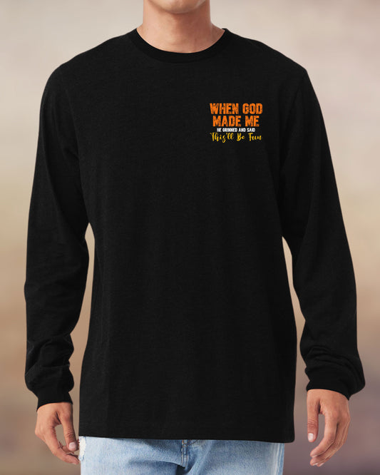 Christian long sleeve black tee with a fun message: “When God made me, He grinned and said this’ll be fun.