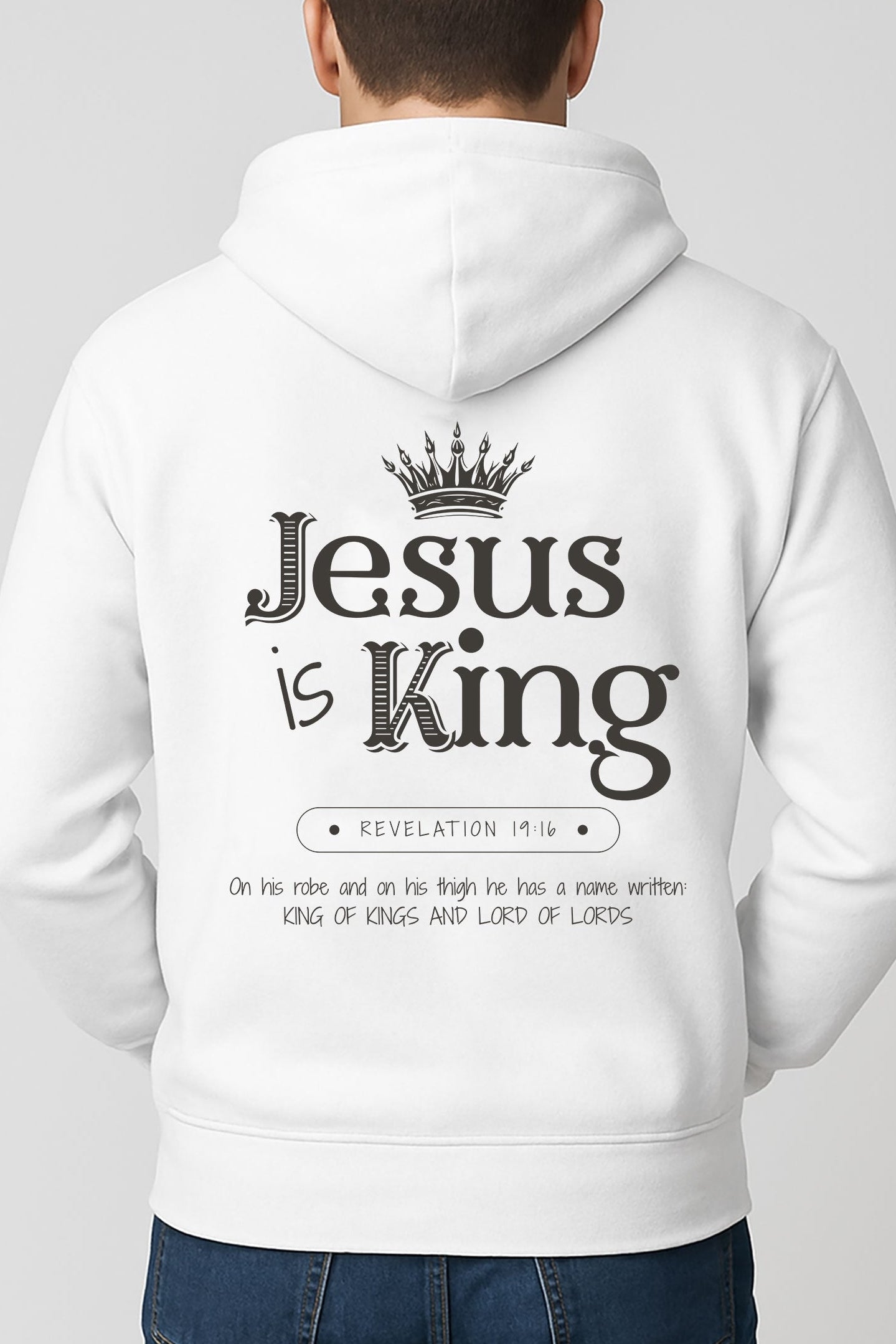 Man wearing white Christian hoodie with “Jesus is King” Revelation 19:16 design on the back
