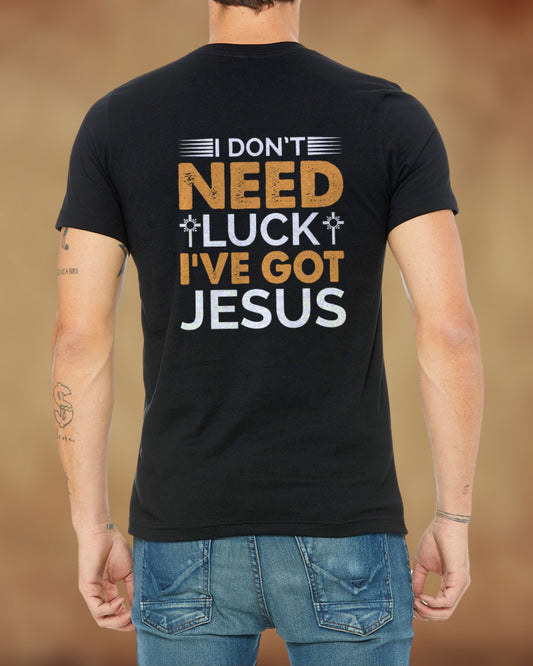 Christian black t-shirt with the phrase “I Don’t Need Luck, I’ve Got Jesus” in gold and white lettering.