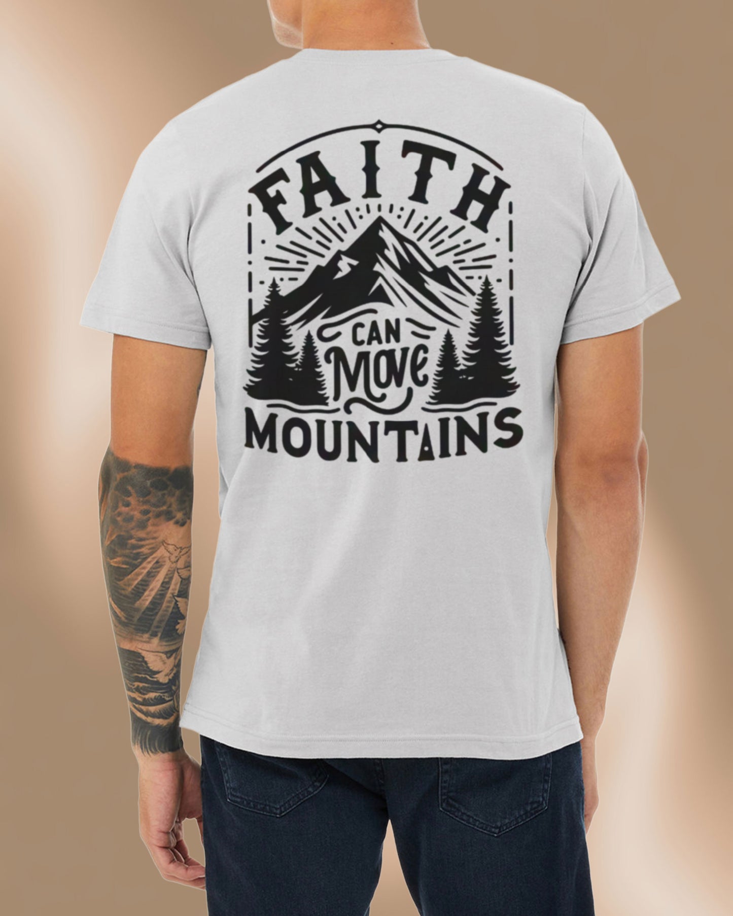 Athletic grey t-shirt featuring a bold mountain design and the phrase “Faith Can Move Mountains.”
