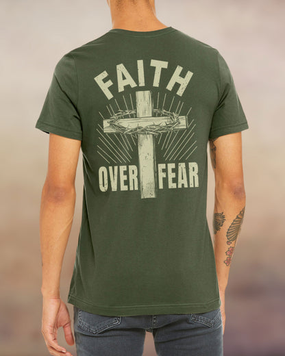 Military green Christian t-shirt with “Faith Over Fear” design featuring a cross and crown of thorns printed on the back.