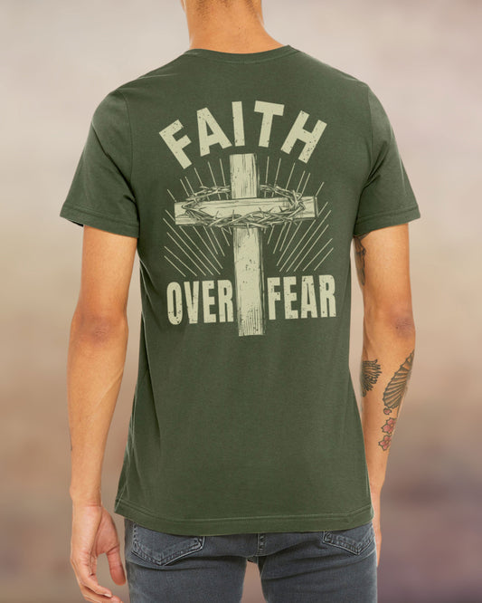 Military green Christian t-shirt with “Faith Over Fear” design featuring a cross and crown of thorns printed on the back.