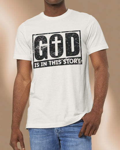 Vintage white Christian tee with bold black distressed text that reads “God is in this story.”
