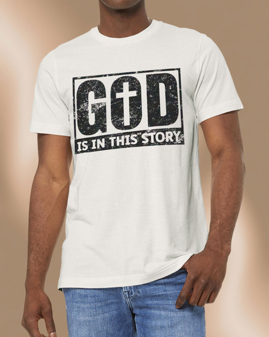 Vintage white Christian tee with bold black distressed text that reads “God is in this story.”