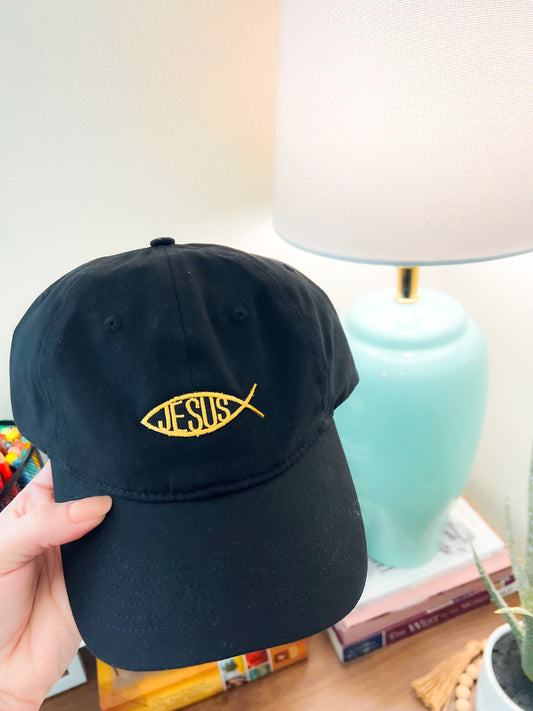 Black cotton cap with heat-pressed embroidered Jesus Fish patch in yellow