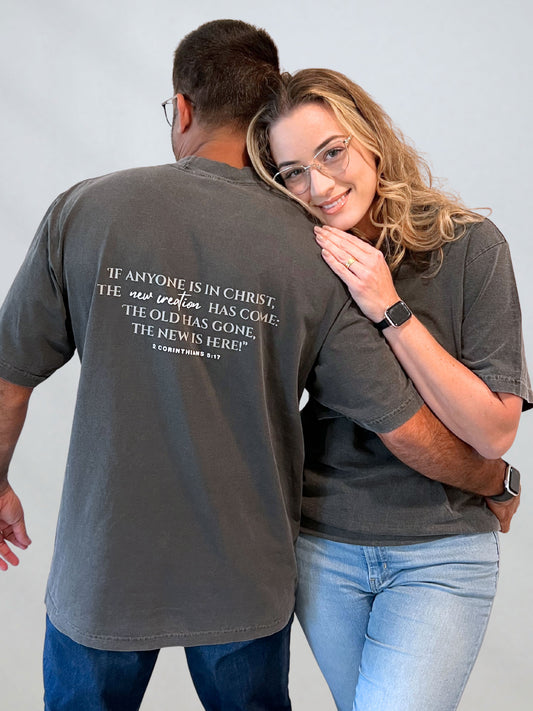 Back view of the New Creation tee featuring the full 2 Corinthians 5:17 scripture.