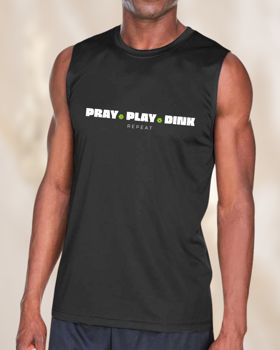 Men’s black sleeveless pickleball performance shirt featuring the phrase “Pray Play Dink Repeat” with pickleball graphics on the front.