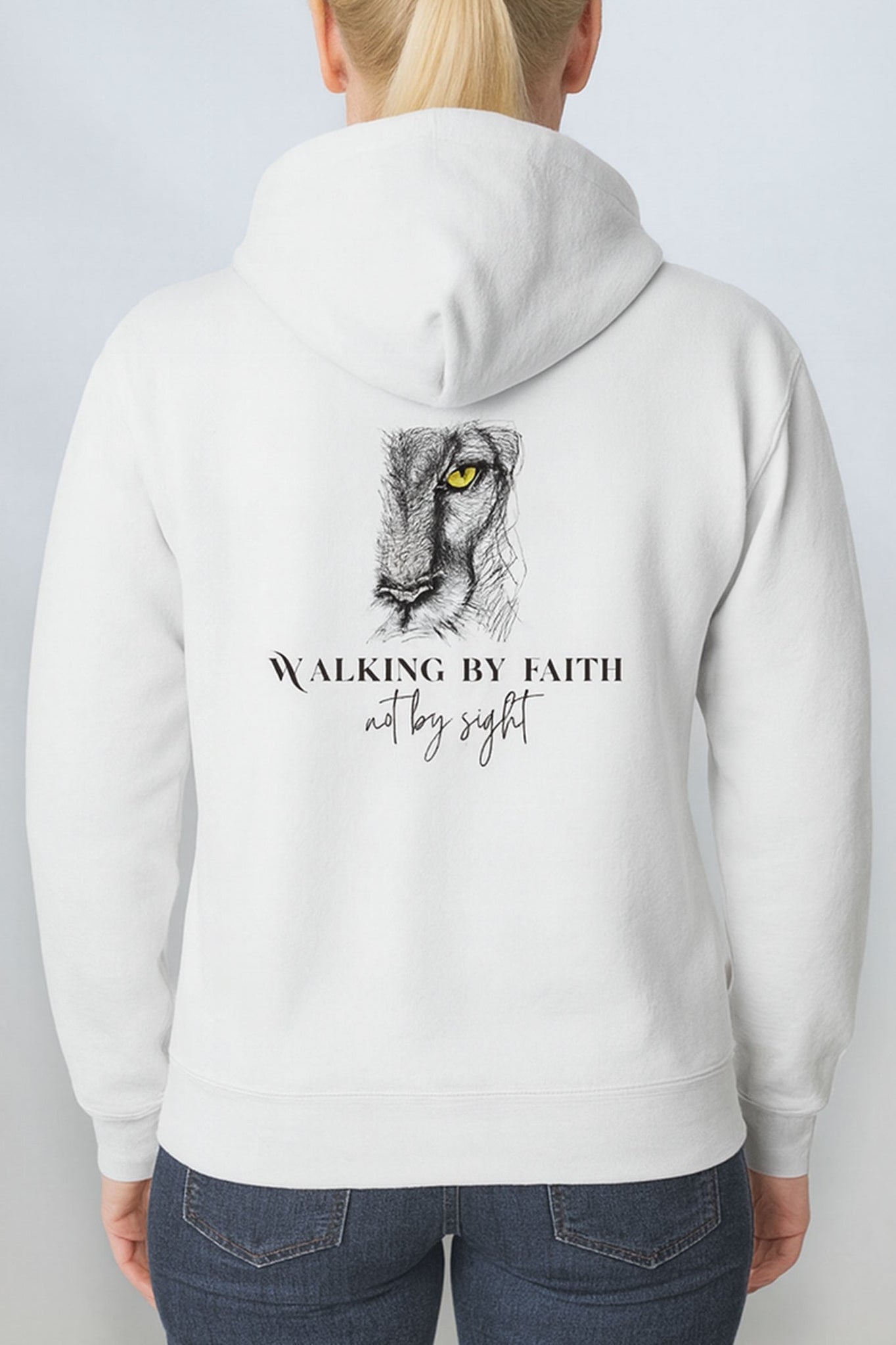 Back of white hoodie featuring detailed lion artwork and ‘Walking by Faith Not by Sight’ Christian design.